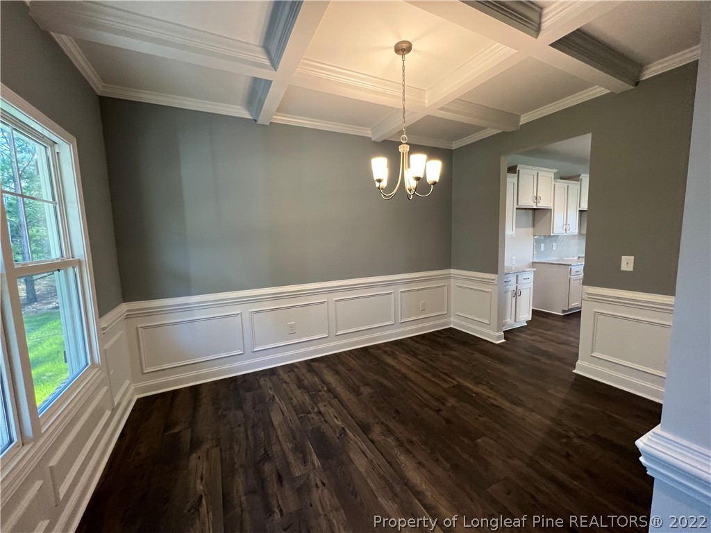 7850 Rufus Johnson Road Fayetteville, NC 28306 - Photo 6 of 11 a view of an empty room with wooden floor and a window