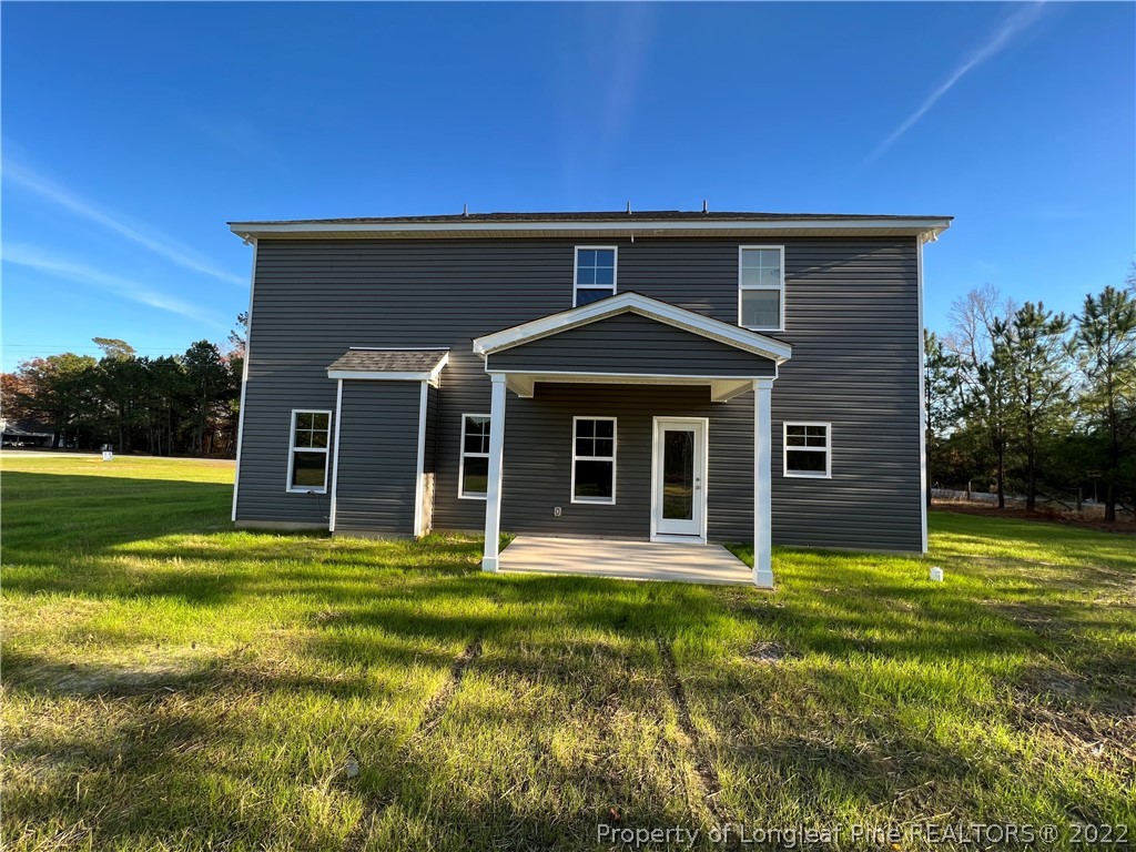 7850 Rufus Johnson Road Fayetteville, NC 28306 - Photo 10 of 11 a front view of a house with a yard