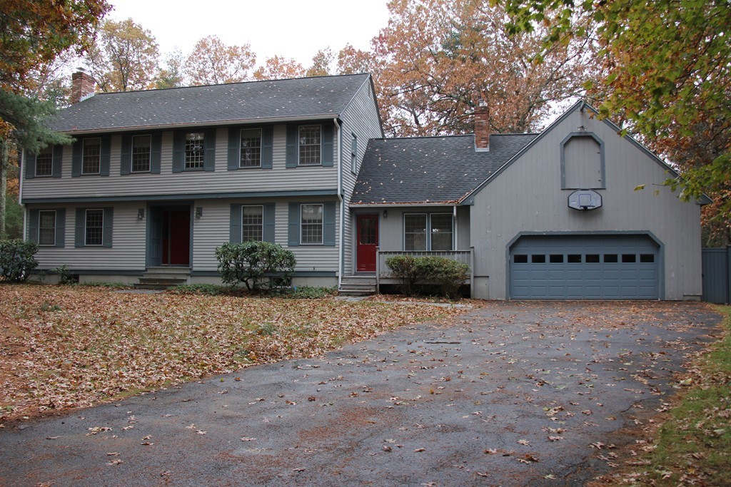 209 Park Road Chelmsford, MA 01824 - Photo 1 of 3 a front view of a house with a yard