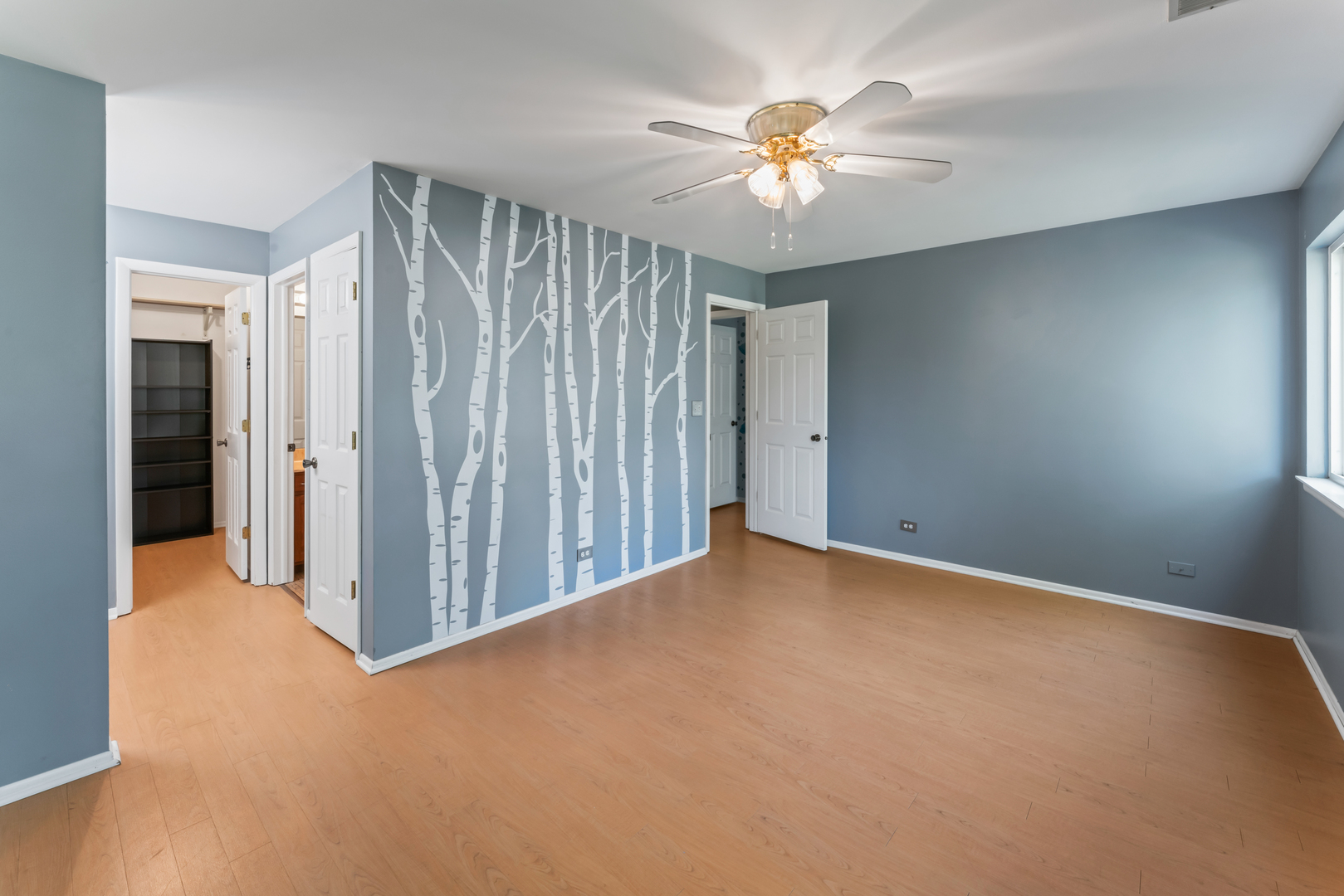 601 Hanover Court, Unit Z2 Schaumburg, IL 60194 - Photo 15 of 22 an empty room with chandelier fan and windows