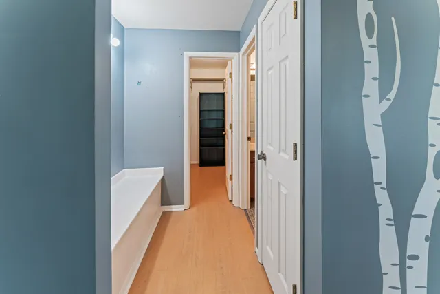 a view of a bathroom from a hallway