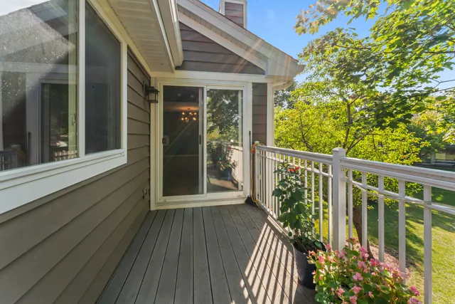 a view of balcony with wooden floor