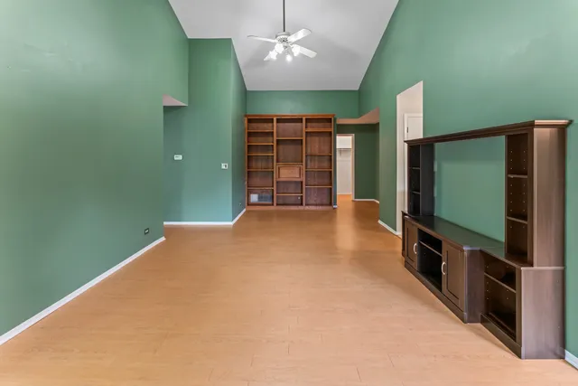 a view of a livingroom with furniture and a flat screen tv