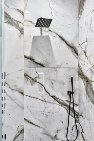 a bathroom with a double vanity sink mirror and toilet