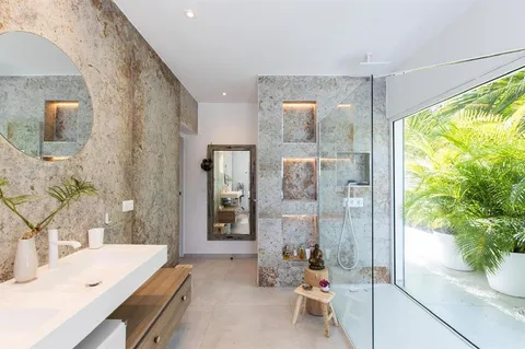 a bathroom with a sink mirror and a bath tub
