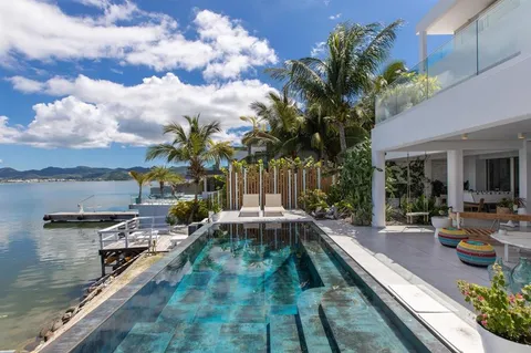 a view of a swimming pool with a patio