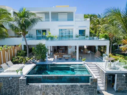 a view of house with outdoor space and swimming pool