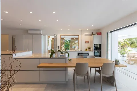 a view of a dining room with furniture window and outside view