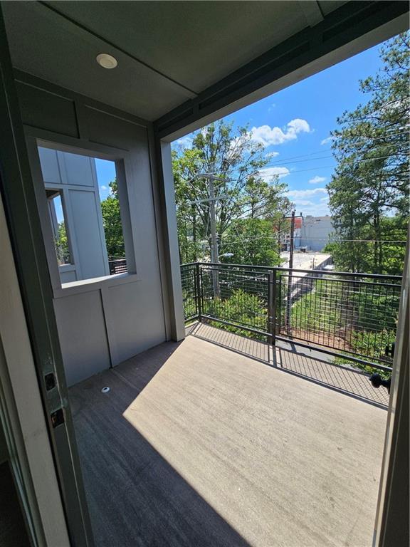 1294 Longreen Terrace Northwest, Unit 2 Atlanta, GA 30318 - Photo 11 of 25 a view of a room with wooden floor and stairs