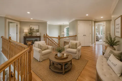 a bedroom with a bed and a ceiling fan