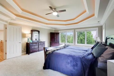 a kitchen with stainless steel appliances granite countertop a stove top oven a sink a dining table and chairs