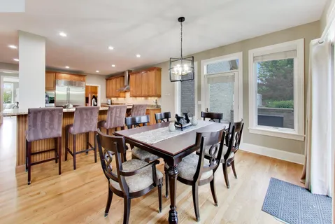 a kitchen with stainless steel appliances granite countertop stove top oven and cabinets
