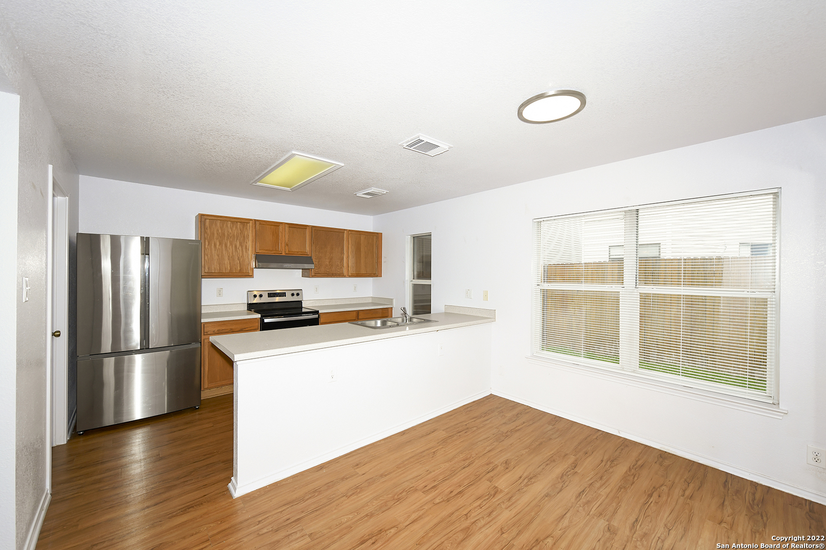 10 Torreys Post San Antonio, TX 78240 - Photo 10 of 27 a kitchen with stainless steel appliances a refrigerator and a stove top oven