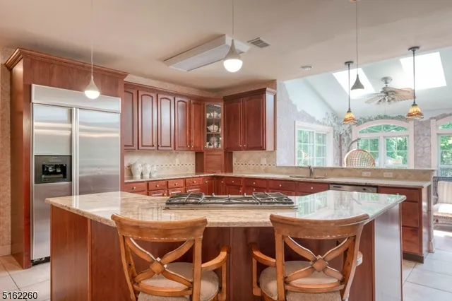 a dining table with chairs and window