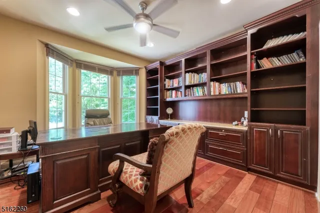 a view of a livingroom with furniture and a bookshelf