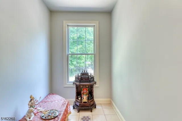 a table and chairs in a small room