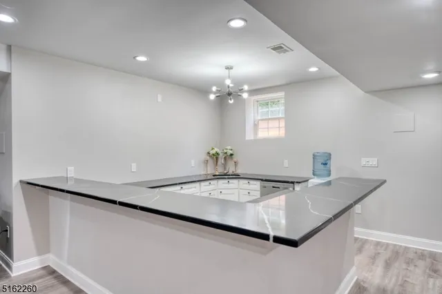 a view of a living room and chandelier