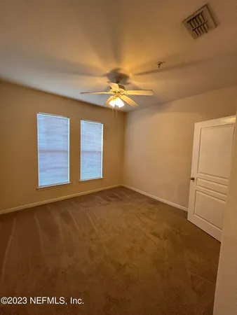 a bathroom with a sink a toilet a shower and a mirror