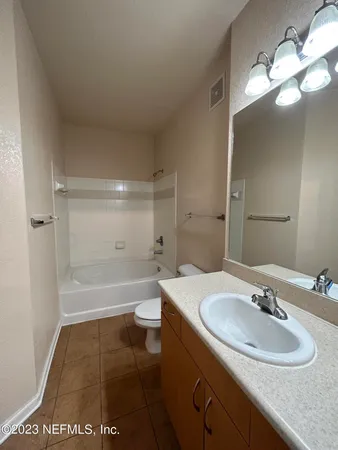 a bathroom with a sink and toilet
