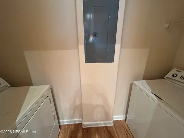 a bathroom with a sink a toilet a shower and a mirror