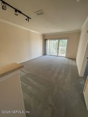 a view of balcony with wooden floor