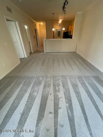 a view of house with yard and sitting area