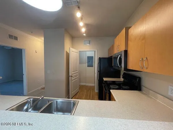 a view of a street with a building in the background