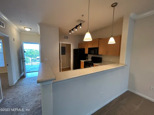 a view of a porch with wooden floor