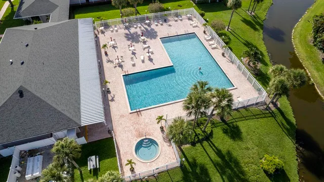 an aerial view of a house with a swimming pool