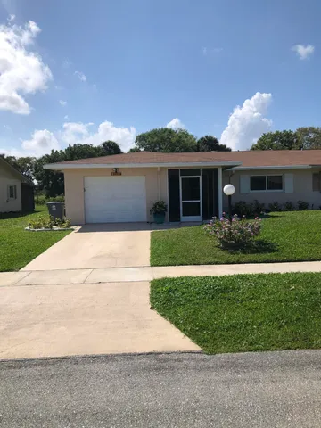 front view of house with a yard
