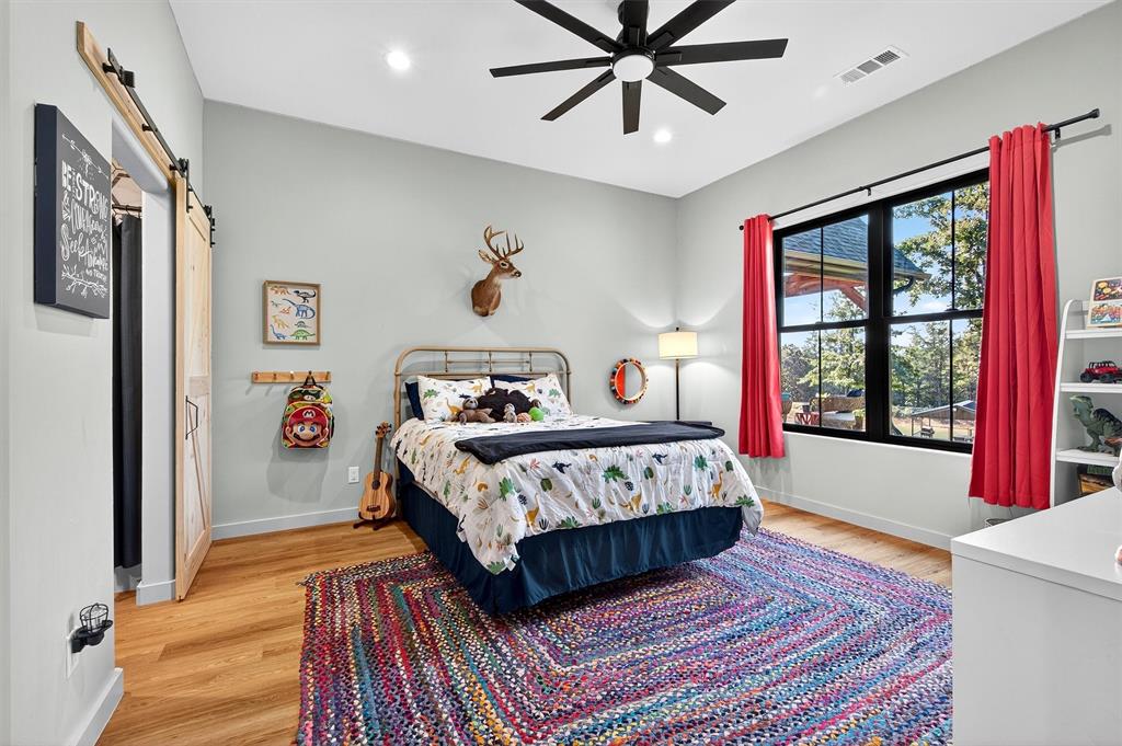 0 Richerson Road Denison, TX 75021 - Photo 13 of 40 a bedroom with a bed a large window with wooden floor