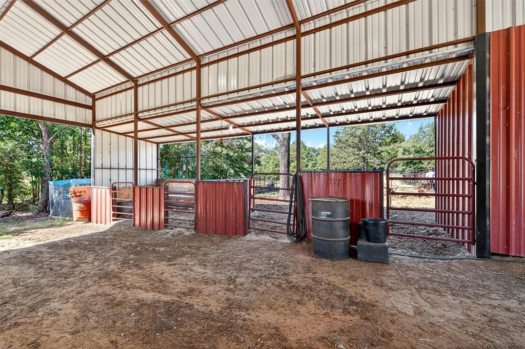 1838 Richerson Road Denison, TX 75021 - Photo 30 of 40 a view of a backyard with wooden fence and large trees