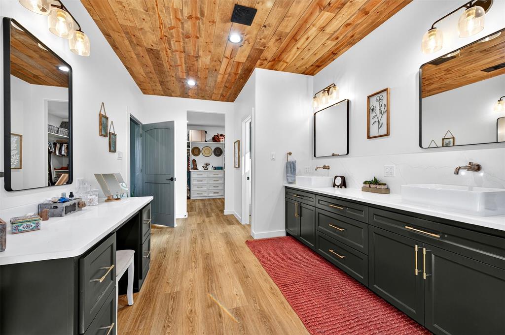 1838 Richerson Road Denison, TX 75021 - Photo 10 of 40 a spacious bathroom with a double vanity sink and a large mirror