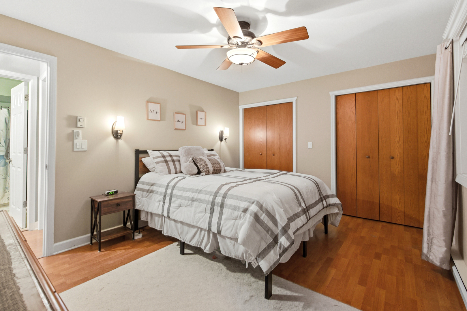 20224 South Frankfort Square Road, Unit G Frankfort, IL 60423 - Photo 10 of 15 a spacious bedroom with a bed and a chandelier