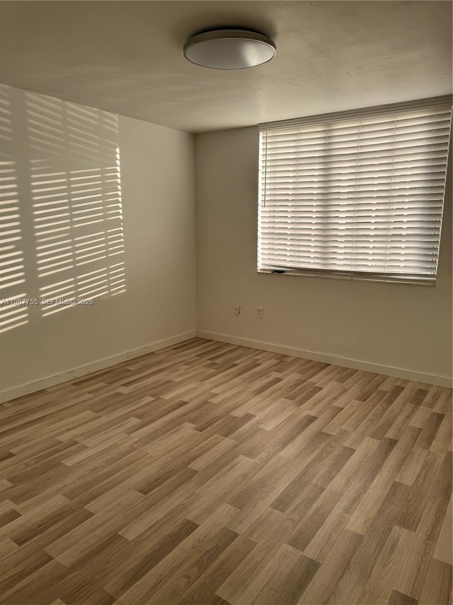 2071 Renaissance Boulevard, Unit 104 Miramar, FL 33025 - Photo 9 of 17 a view of an empty room with a window