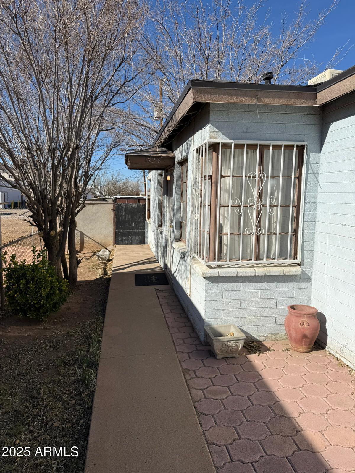 1224 F Avenue Douglas, AZ 85607 - Photo 1 of 16 a front view of a house with a outdoor space