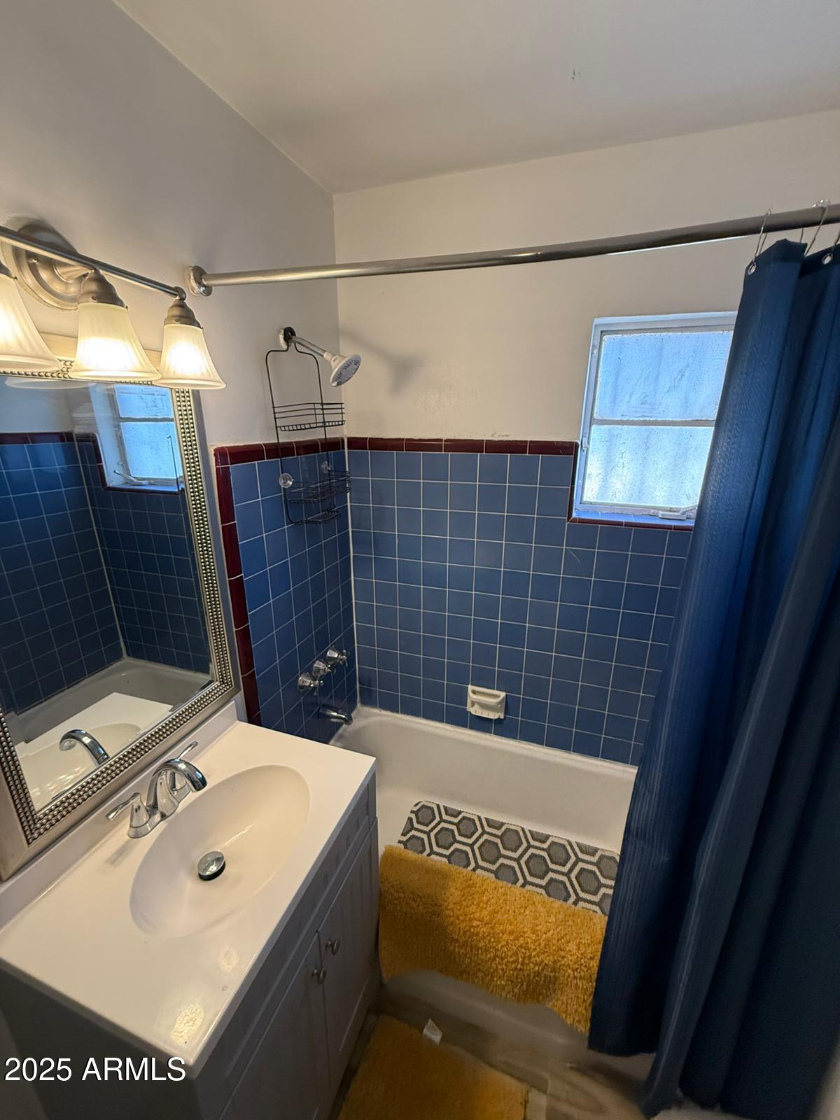 1224 F Avenue Douglas, AZ 85607 - Photo 11 of 16 a bathroom with a sink and a mirror