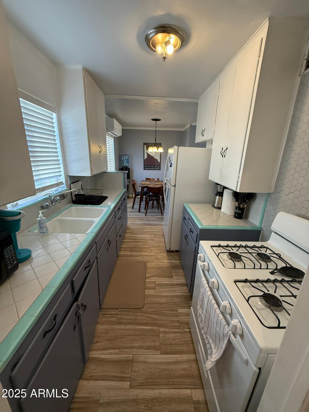 1224 F Avenue Douglas, AZ 85607 - Photo 15 of 16 a kitchen with stainless steel appliances granite countertop a stove and a sink
