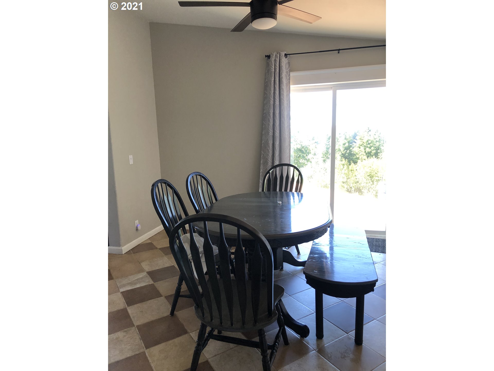 8245 Burbank Road Tillamook, OR 97141 - Photo 18 of 28 a view of a dining room with furniture and a window