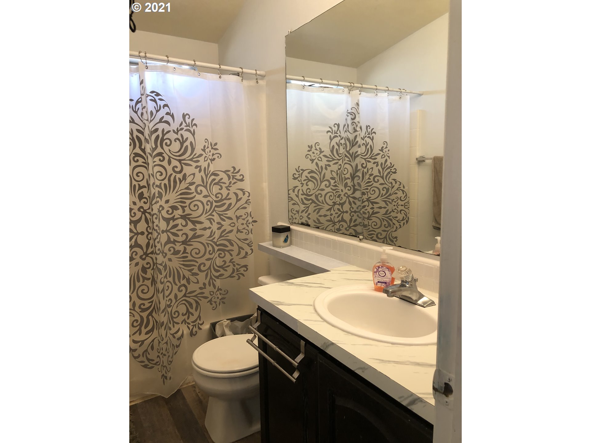 8245 Burbank Road Tillamook, OR 97141 - Photo 20 of 28 a bathroom with a sink toilet and shower