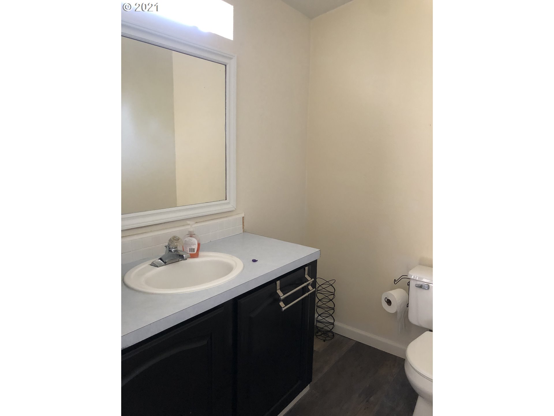 8245 Burbank Road Tillamook, OR 97141 - Photo 6 of 28 a bathroom with a sink and a mirror