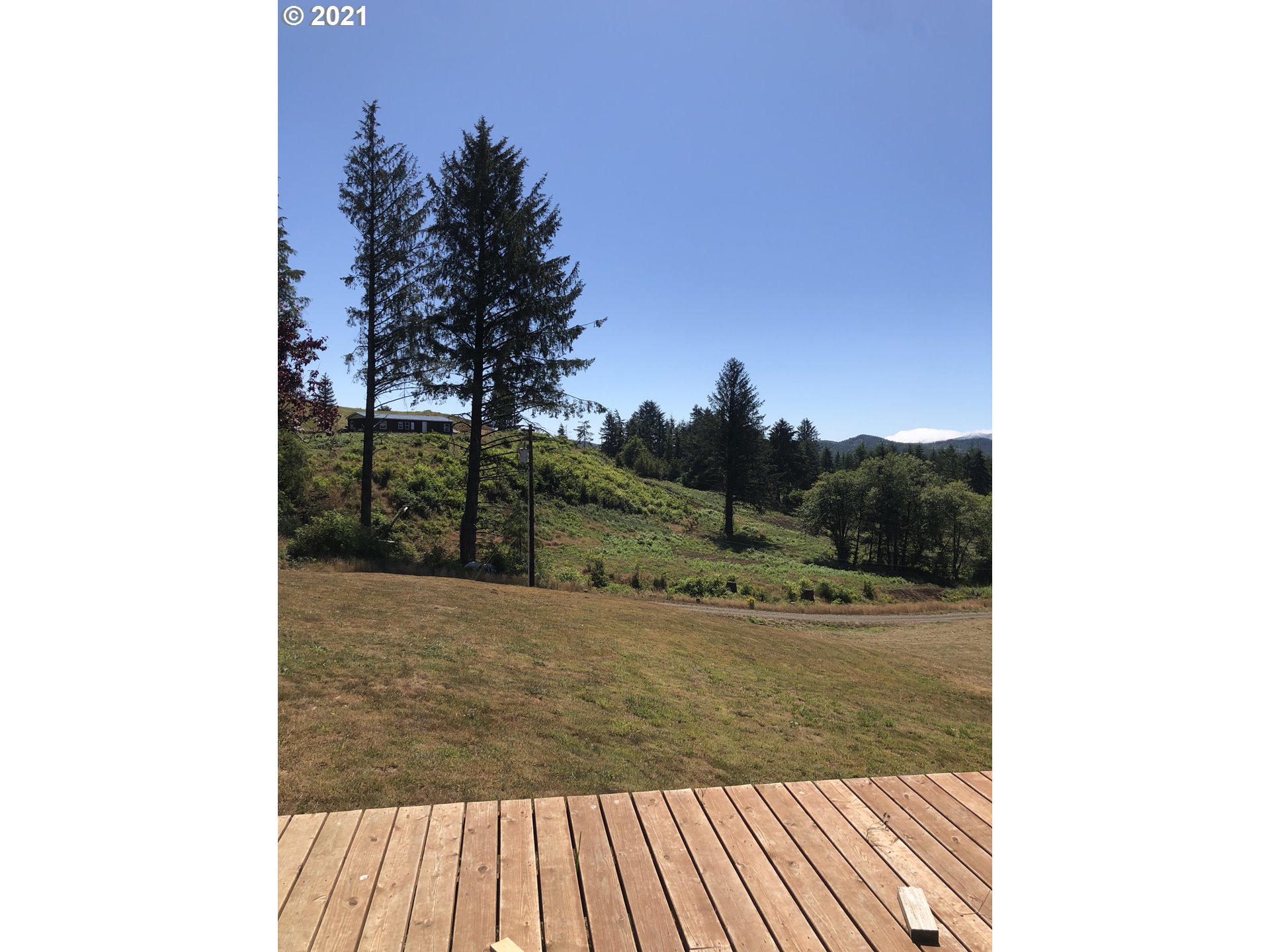 8245 Burbank Road Tillamook, OR 97141 - Photo 7 of 28 a view of a outdoor space with trees
