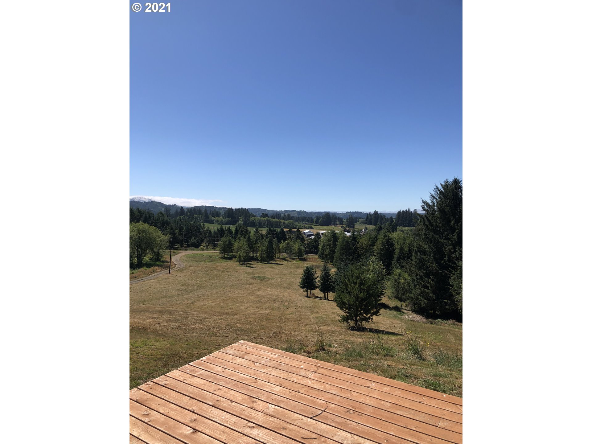 8245 Burbank Road Tillamook, OR 97141 - Photo 9 of 28 a view of a lake from a balcony