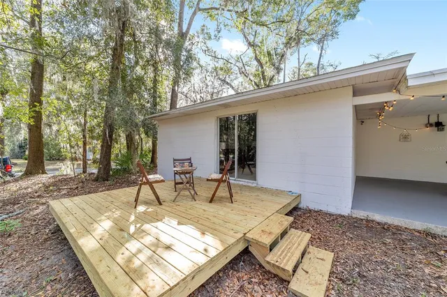 a view of a backyard with a patio