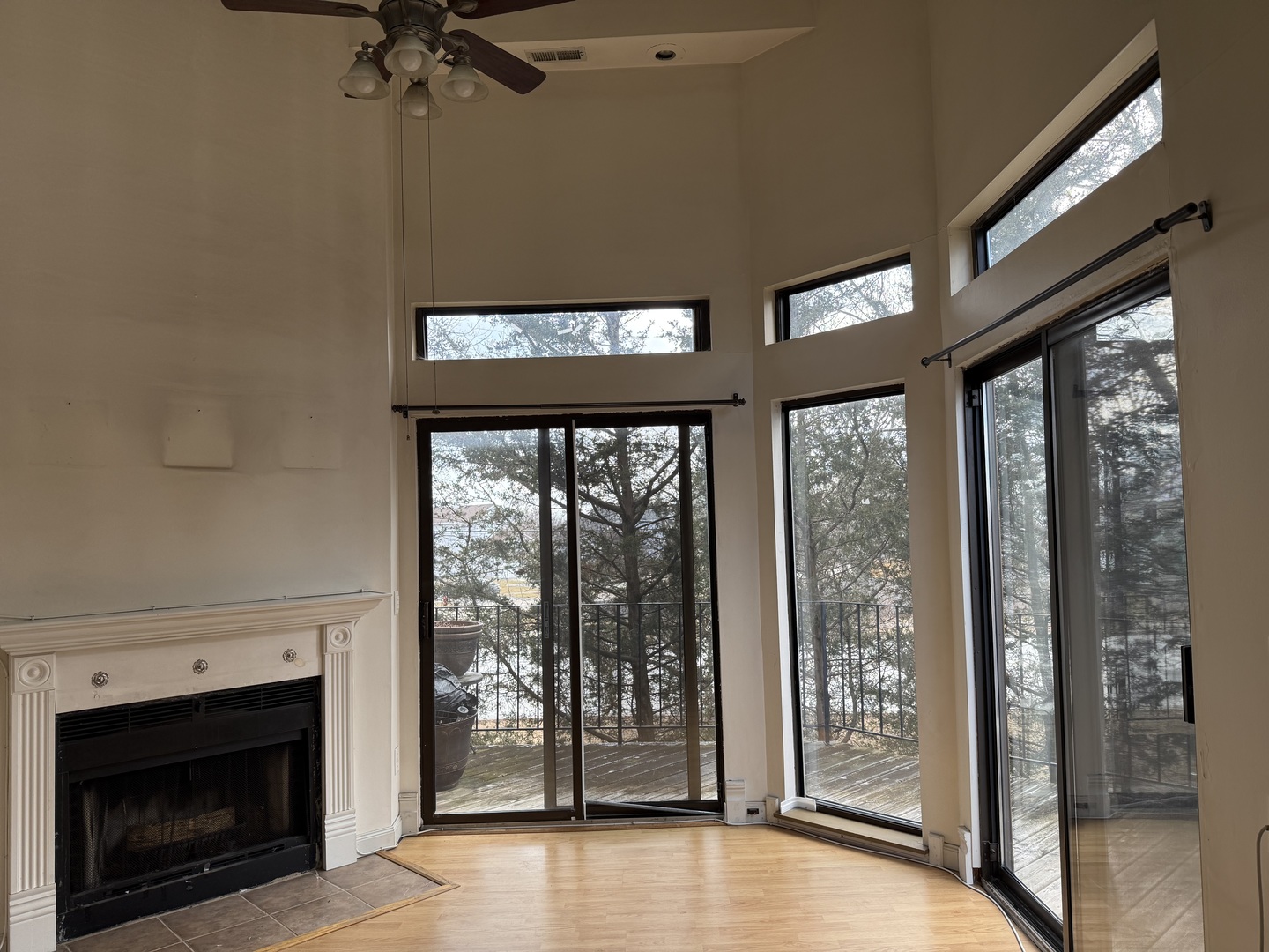 383 Wilmington Drive, Unit E Bartlett, IL 60103 - Photo 2 of 17 a view of an empty room with a fireplace