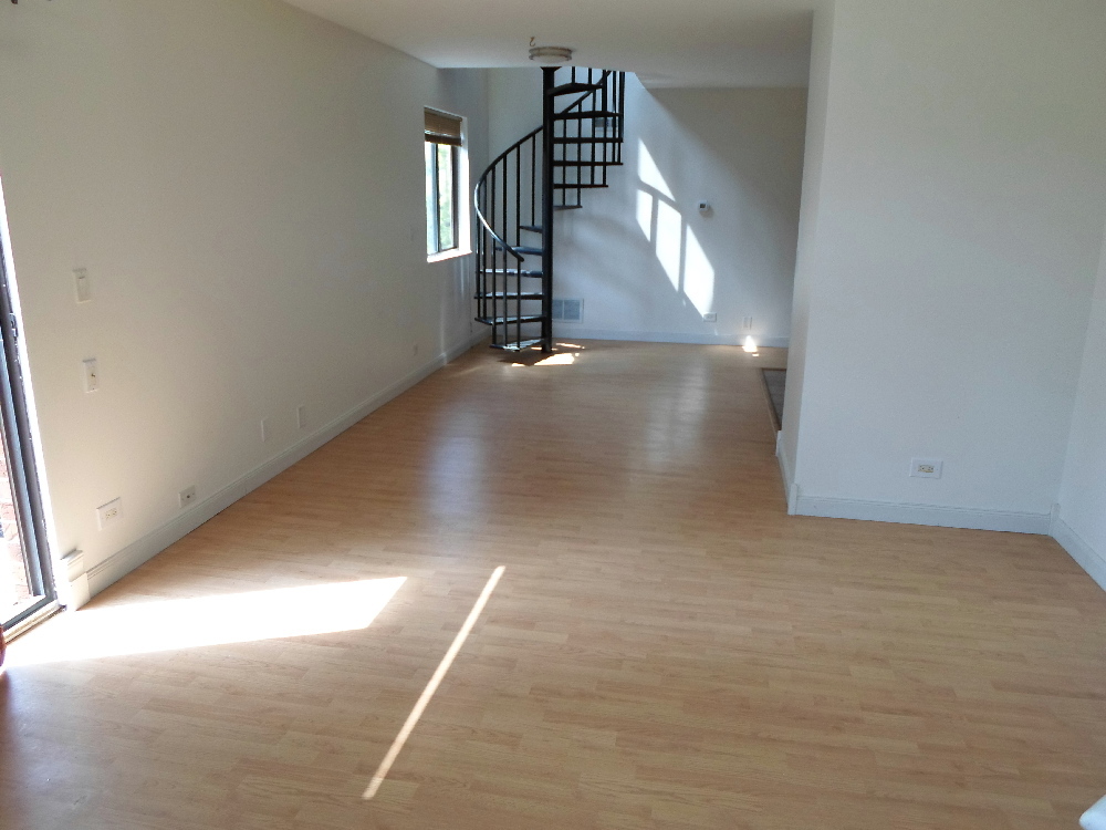383 Wilmington Drive, Unit E Bartlett, IL 60103 - Photo 6 of 17 a view of a hallway with staircase