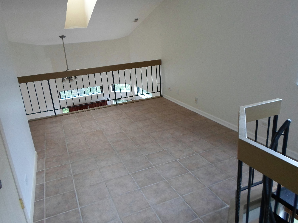 383 Wilmington Drive, Unit E Bartlett, IL 60103 - Photo 8 of 17 a view of a hallway with seating area