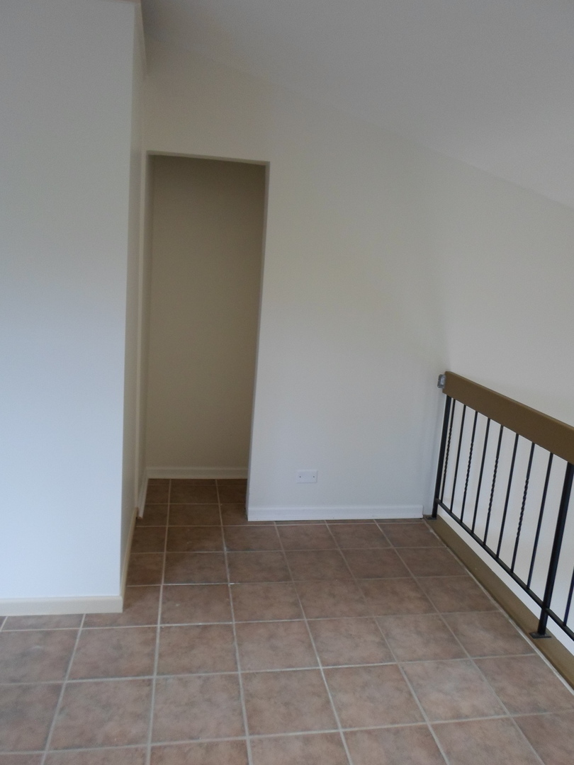 383 Wilmington Drive, Unit E Bartlett, IL 60103 - Photo 9 of 17 a view of an empty room