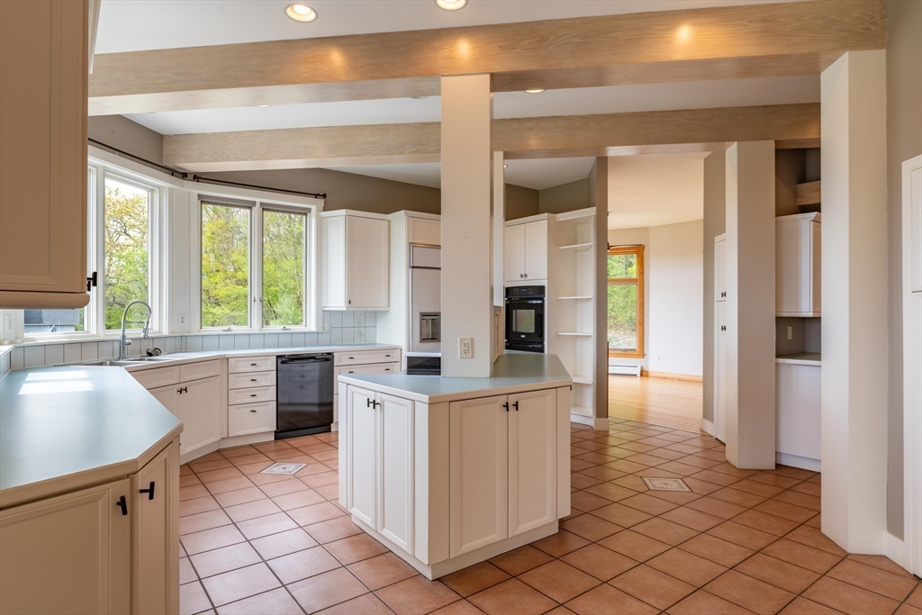 184 W Road Bernardston, MA 01337 - Photo 17 of 41 a kitchen with a stove a sink and a refrigerator