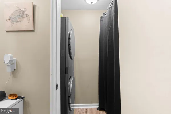 a bathroom with a shower and a mirror